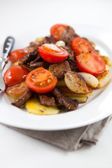 Beef with potatoes,cherry tomatoes and onion