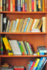 Bookcase full of books photographed with soft focus.  