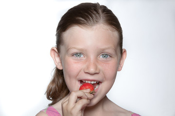 Blue-eyed girl with strawberry