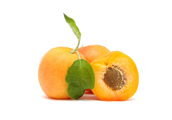 Apricots with leaves on a white background