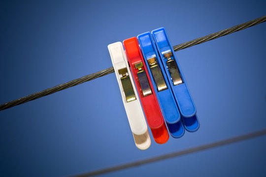 Colourful Clothes Pegs On A Washing Line