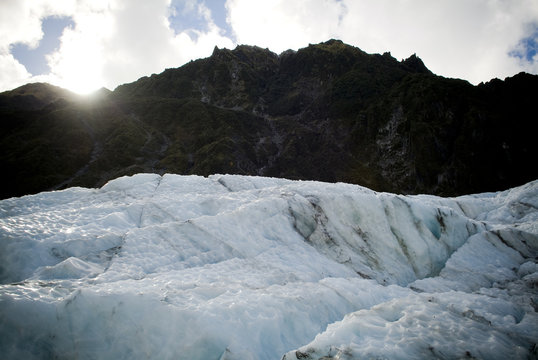 Sunrise over a mountain with Franz Josef Glacier in New Zealand
