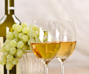 Still-life with bunch of grapes and white wine