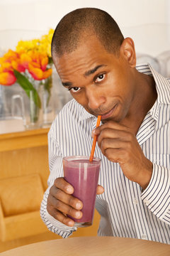 Man Drinking A Smoothie