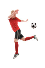 Fototapeta na wymiar Soccer player kicking the ball isolated on white