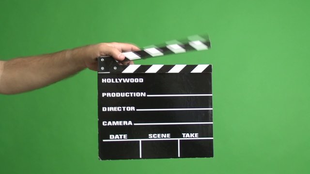 movie clapper board on a green screen