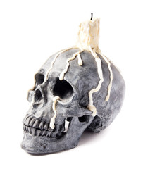 scary halloween skull with melted candle