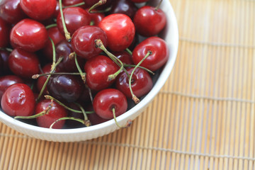 A bowl filled with fresh cherries