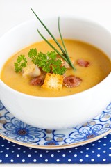 vegetable soup with rusk, bacon and herbs