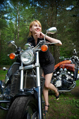 Fototapeta na wymiar Happy girl and motorcycle