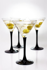 Martini with olives on a white background