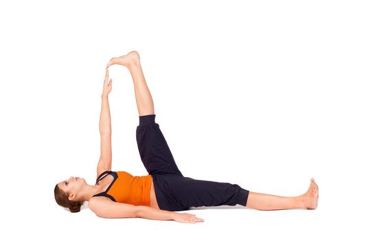 Woman Practicing Reclining Big Toe Yoga Pose
