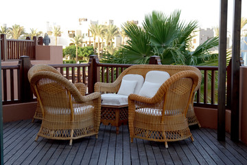 interior. armchair and table on balcony.