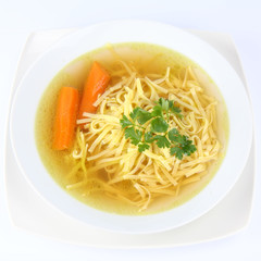 Chicken soup with macaroni, parsley and carots