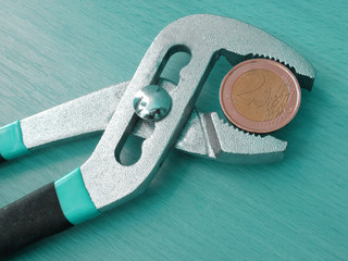 one euro coin under pressure