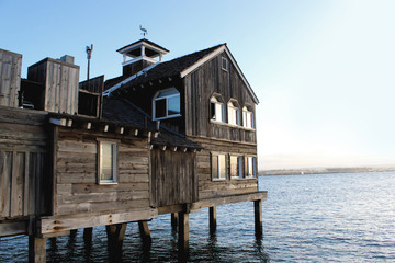 old wooden house on sea