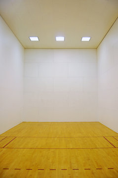 Empty Room with Wooden Floor and White Walls