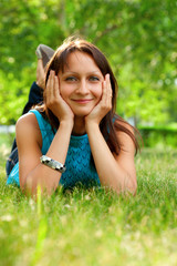 woman laying on the gras in the park