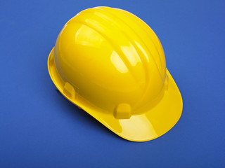 Fototapeta premium Yello Hardhat On Blue