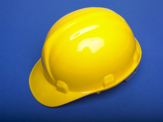 Fototapeta premium Yello Hardhat On Blue