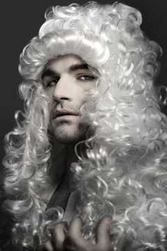 Young man in wig