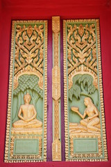 Fototapeta na wymiar buddhist art on window of temple, Wat Ku Ka Singh, Roi-Et