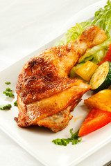 Roasted chicken leg and vegetables