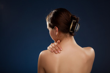 Woman massaging pain back