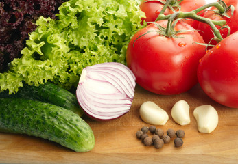 Fresh vegetables on wooden hardboard