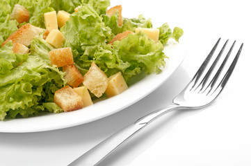 Close-up of salad on white plate.