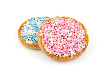 Rusk with blue and pink mice over white background