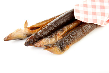 smoked eel over white background