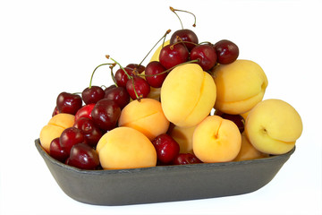 Naklejka na ściany i meble Cherry and apricots in bowl