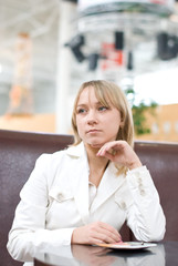 Fototapeta premium Young businesswoman waiting in cafe