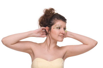 Close up portrait of young beautiful woman with feather make up