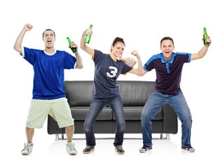 Three sport fans celebrating the victory