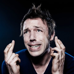 Funny Man Portrait with crossed fingers