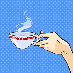 Hand with a cup of tea