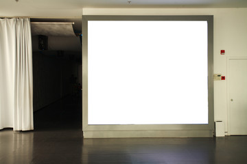 frames on  wall at night in city