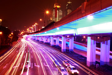 Fototapeta na wymiar modern urban city at night with freeway traffic .