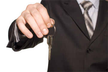business man give a key isolated over white