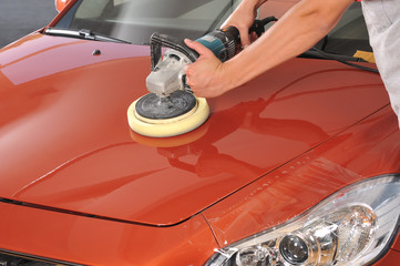 Car care with power buffer machine at service station.