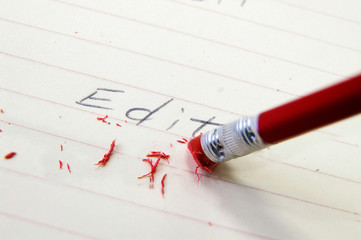 closeup of a pencil eraser correcting an error