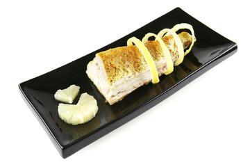 roast tuna with lemon on ceramic plate