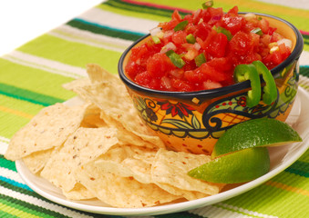 Tortilla chips with salsa and lime