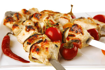 roast chicken shish kebab on white