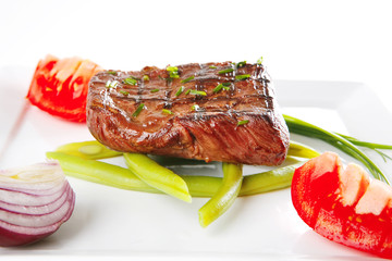 roast fillet served with tomato