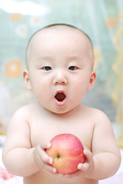 cute baby eat apple