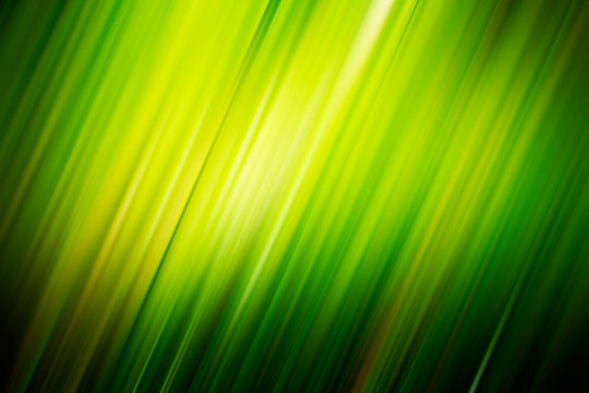 Green blurry diagonal rays. Background for design works.