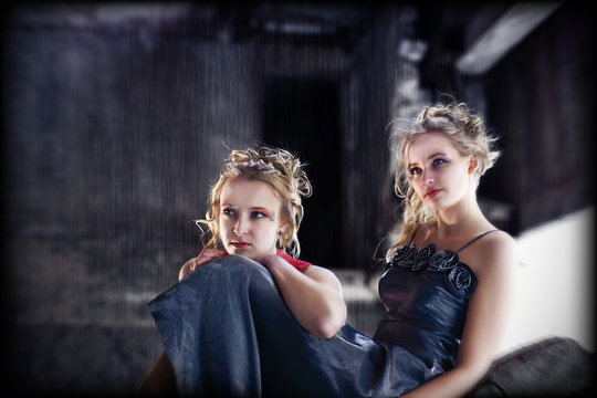 Young women on grunge industrial background